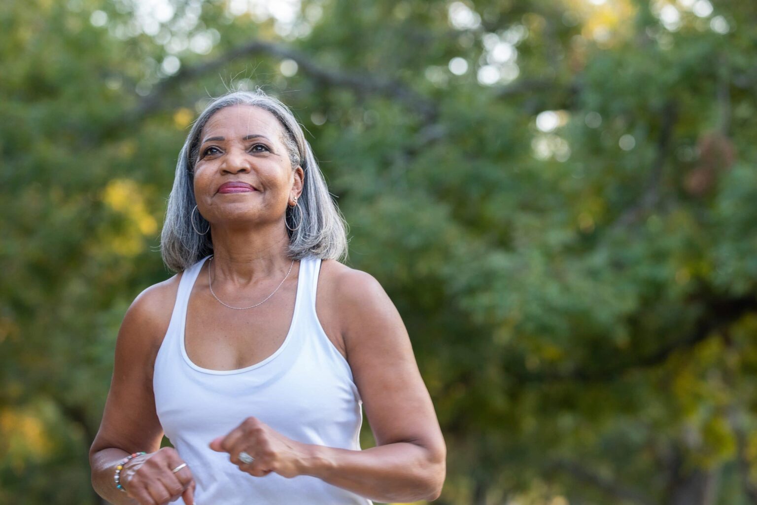 Woman going for a brisk walk in nature.