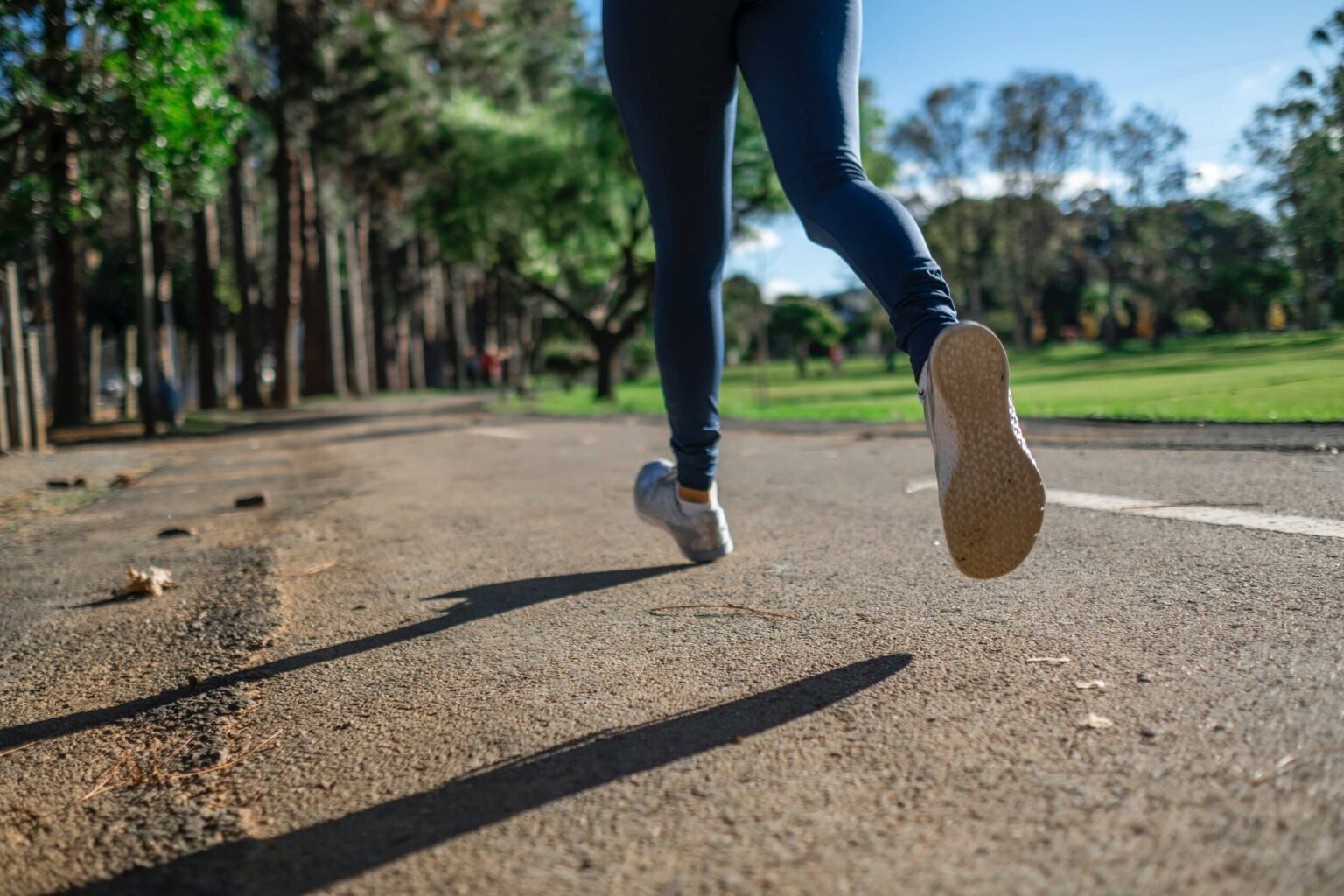 Close up of a woman running outside.