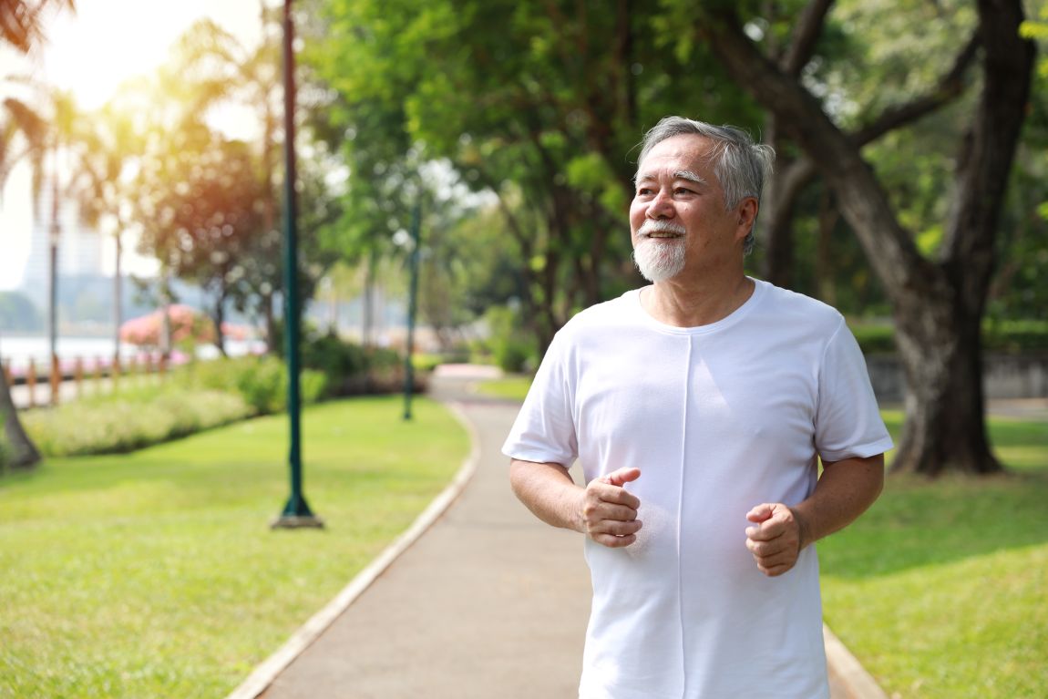 man jogging on park path